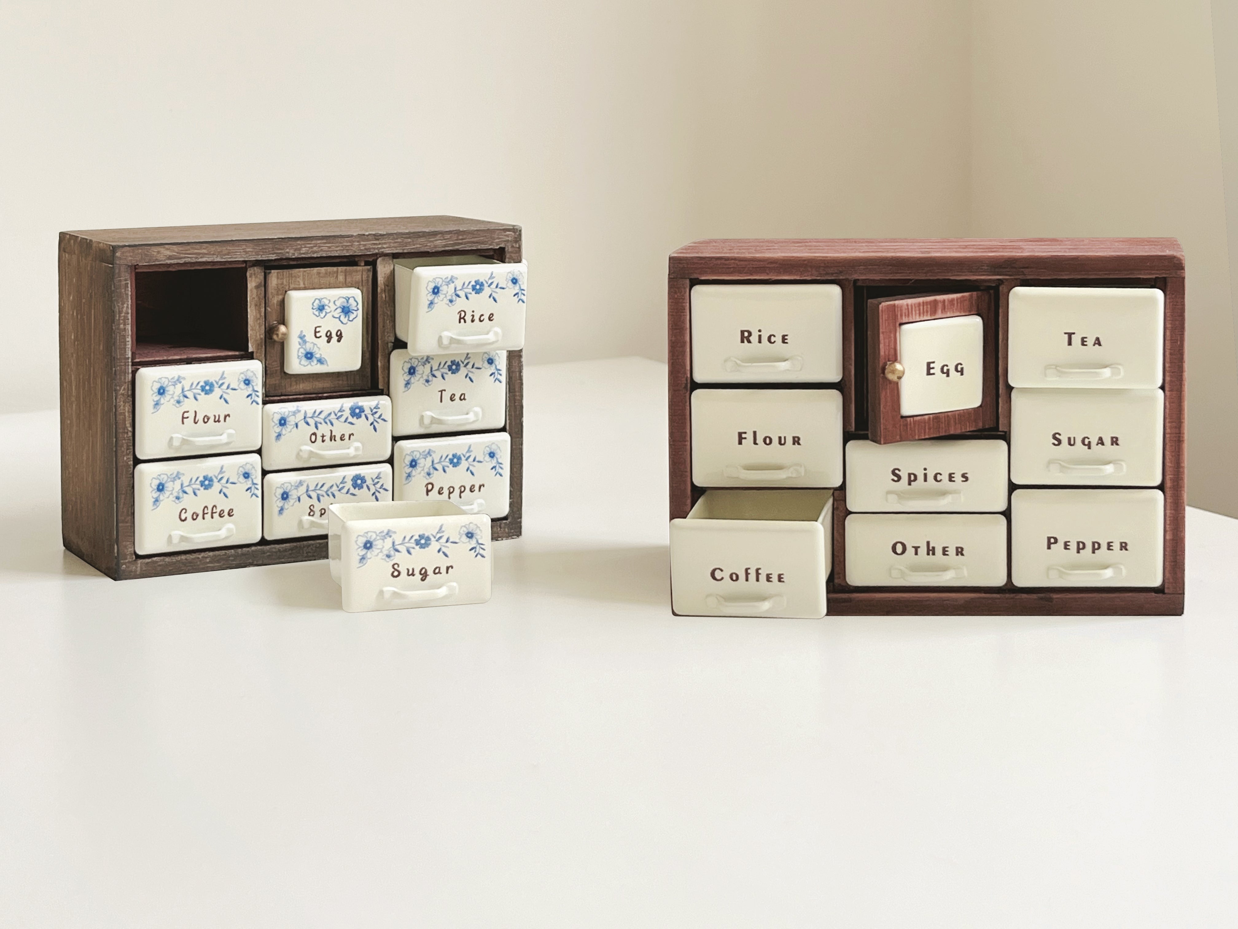 Antler Brown and Red Bean miniature spice cabinets with open drawers and center Egg doors