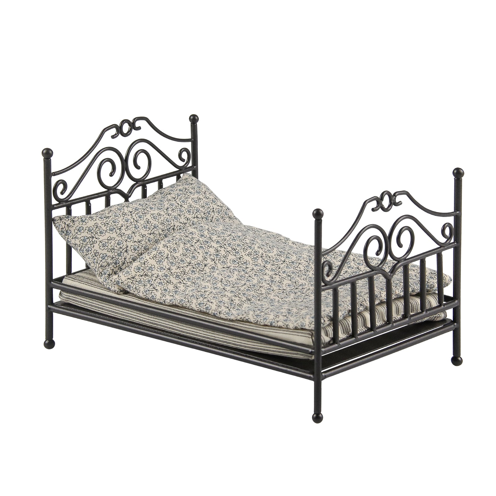 Black 1:12 scale dollhouse antique bed with lighter small-floral bedding on white background