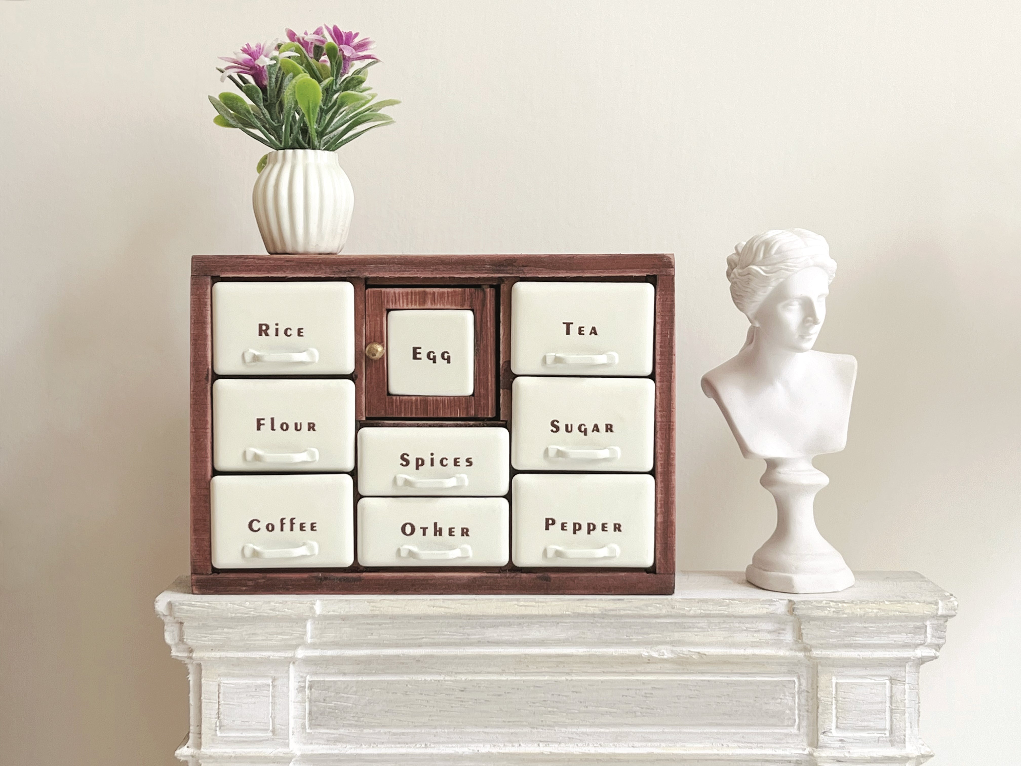Red Bean spice cabinet with Coffee drawer and Tea drawer open on fireplace mantel
